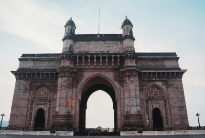 Captivating view of the historical Gateway of India monument under a clear blue sky in Mumbai.