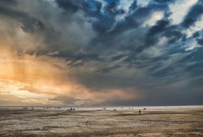 Stunning sunset over Kutch desert captures dramatic sky and vast expanse.